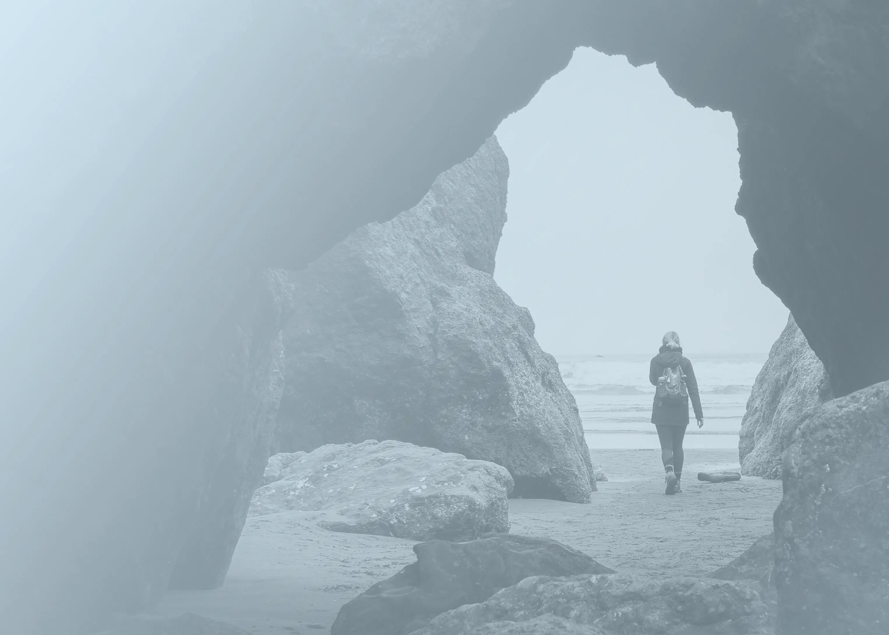 An adult woman leaving from a cave