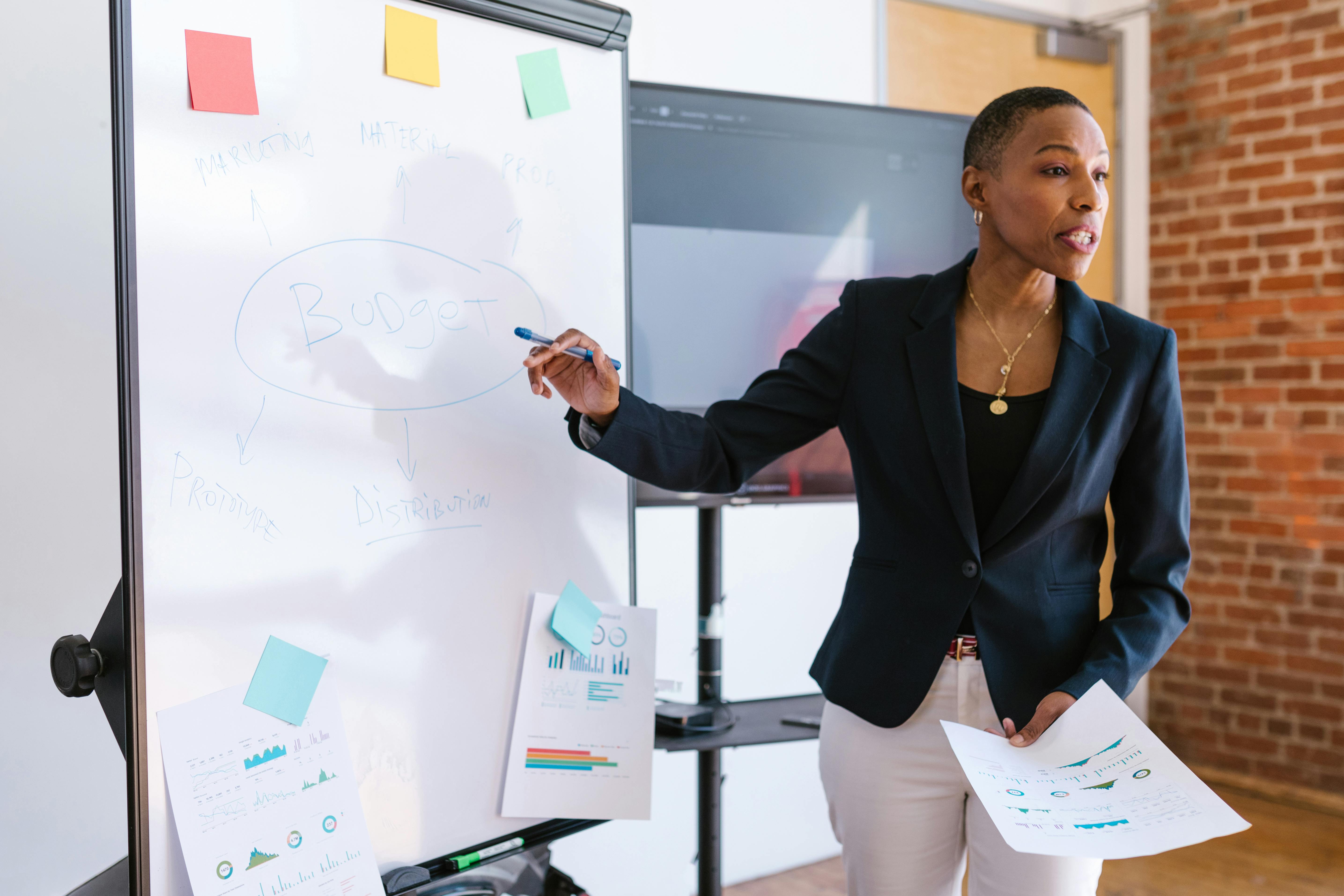 An African American woman speaking in a meeting room